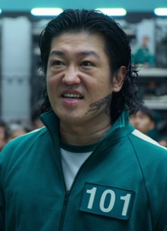 Player 101, Jang Deok-su, is in his green Squid Gsame Tracksuit.
